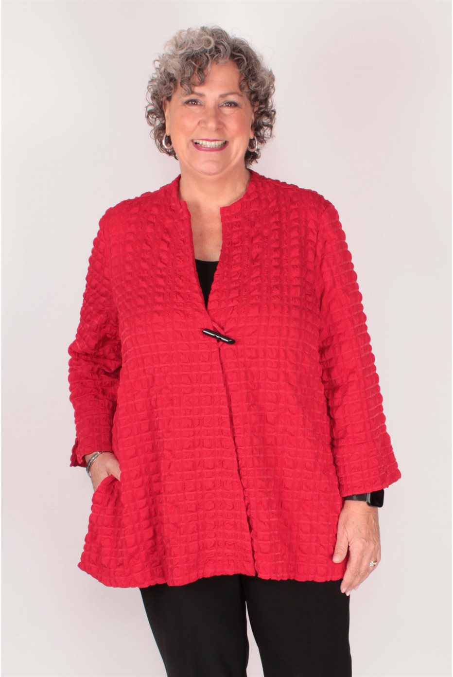 Blouson trapèze rouge en jacquard à bulles